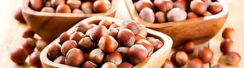 Hazelnuts in wooden bowls