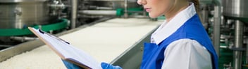 Food factory operative conducting an HACCP survey