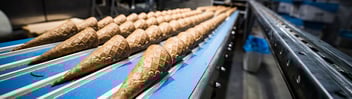 Ice cream cones on food factory conveyor
