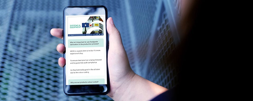 Online lubrication training on mobile screen held in hand